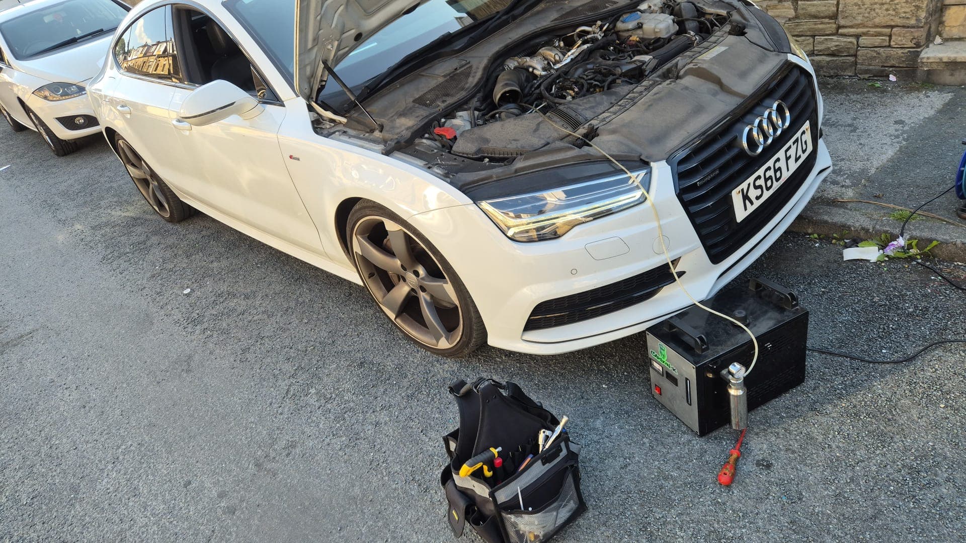 Car exhaust smoke during a smoke leak test